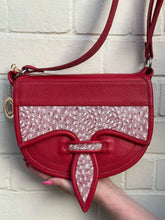Load image into Gallery viewer, Handmade Rubi leather Carriel bag with unique Mola appliqué, showcasing exquisite craftsmanship and vibrant red color.