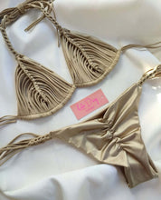Load image into Gallery viewer, Luxury beige bikini set with ruffled detailing, featuring adjustable ties, elegantly displayed on soft fabric.
