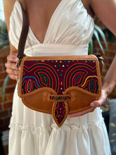 Load image into Gallery viewer, Handmade leather carriel bag with colorful Mola applique, showcasing unique Colombian craftsmanship.
