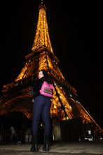 Load image into Gallery viewer, Handcrafted Fuchsia Leather Rucksack with Mola Applique being showcased in front of the illuminated Eiffel Tower at night.