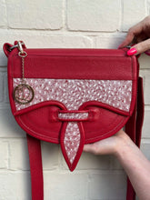 Load image into Gallery viewer, Handmade red Rubi leather Carriel bag with Mola appliqué, showcasing exquisite craftsmanship and vibrant design.
