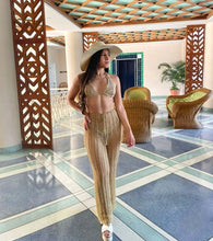 Load image into Gallery viewer, Luxury crochet trousers in gold style, perfect fit cover-up, model wearing in an elegant indoor setting.