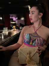 Load image into Gallery viewer, πππ₯π’ β Hand beaded crop bikini being worn at a stylish bar, showcasing vibrant colors and intricate embroidery.