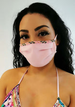 Load image into Gallery viewer, Elegant Adara hand-beaded face mask in pink worn by a woman, blending style and protection.