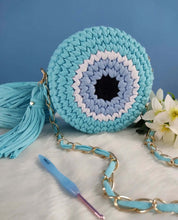 Load image into Gallery viewer, Cute Handmade Greek Eye crochet Handbag featuring a unique round design in shades of blue.