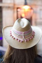 Load image into Gallery viewer, Handmade Iraca Palm Hat with colorful pom-poms and decorative ribbons, showcasing artisanal craftsmanship.