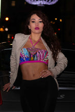 Load image into Gallery viewer, Bali β Hand beaded crop bikini modeled with a stylish jacket, showcasing vibrant colors and luxurious hand-embroidered details.