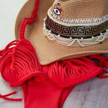 Load image into Gallery viewer, Elegant red macrame bikini paired with a stylish hat, showcasing intricate craftsmanship and beach-ready vibes.