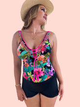 Load image into Gallery viewer, Model showcasing the ๐๐๐ฌ๐ ๐ฅ Tankini with floral design and hand-beaded details, paired with comfortable shorts.