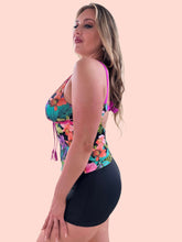 Load image into Gallery viewer, Model showcasing the ๐๐๐ฌ๐ ๐ฅ Tankini in vibrant floral design, featuring a comfortable black short bottom.