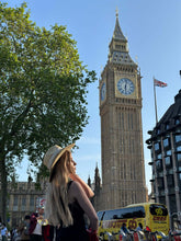 Charger l'image dans la galerie, Woman wearing a hat in front of Big Ben, showcasing London architecture and a beautiful sunny day.