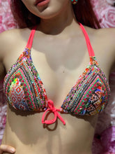 Laden Sie das Bild in den Galerie-Viewer, Deira hand beaded bikini in vibrant coral and colorful patterns with adjustable tie design.