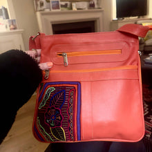 Load image into Gallery viewer, Handcrafted Burnt Orange Leather Handbag with Mola, featuring unique MOLA appliqué and multiple zippered compartments.