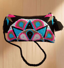 Load image into Gallery viewer, Handcrafted Wayuu terry cloth clutch with vibrant embellishments and tassel details, showcasing artisanal craftsmanship.