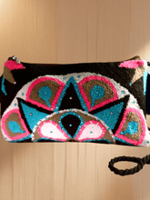 Load image into Gallery viewer, Embellished Wayuu terry cloth clutch showcasing vibrant colors and intricate handmade patterns.