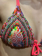 Laden Sie das Bild in den Galerie-Viewer, Close-up of hand-beaded bikini top with vibrant coral, pink, and multi-colored intricate designs.