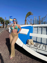 Load image into Gallery viewer, Woman in bikini and sunglasses next to a colorful boat, enjoying a sunny day at the beach.